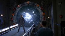 Teal'c confronts the Goa'uld, attempting to prevent him to pass through the Stargate.