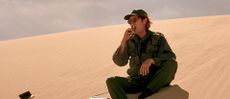 Daniel Jackson is eating a 5th Avenue bar in the Abydos desert.